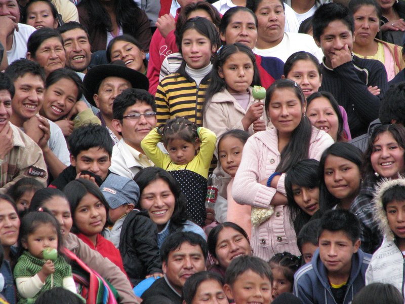 a crowd of happy Peruvians