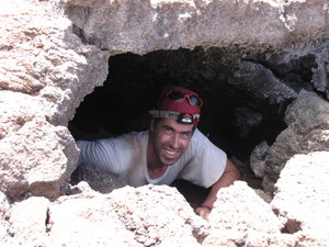 Dave climbs through underground lava tunnel