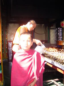 a little monk inside a temple at swayambunath