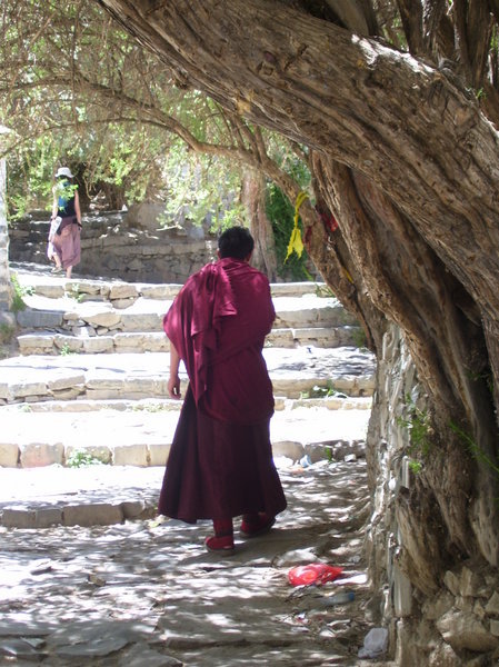 a monk walking around monastery