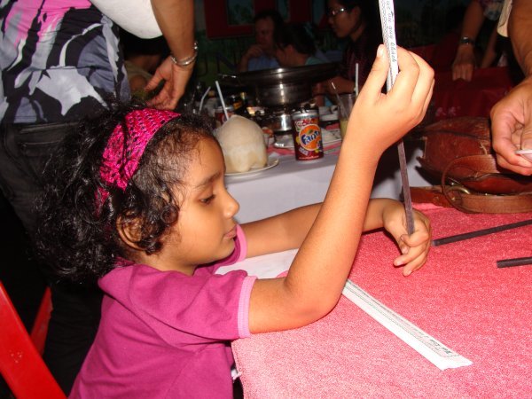 Sanaa - intrigued by the chopsticks