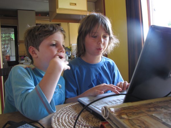 Joshua and Caleb on th computer