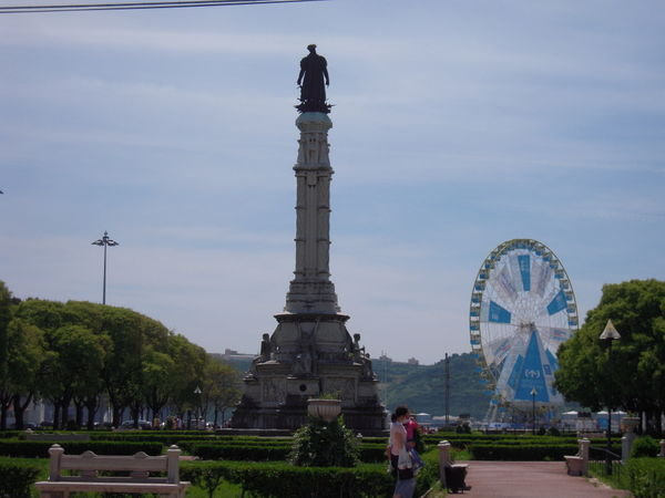 Belem Statue and Ferris Wheel
