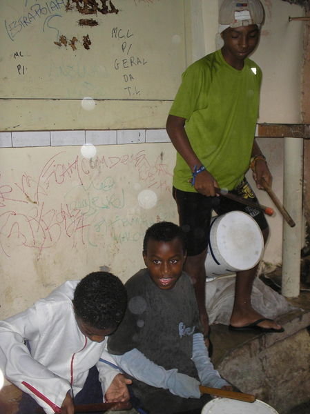Some kids playing music in the Favela