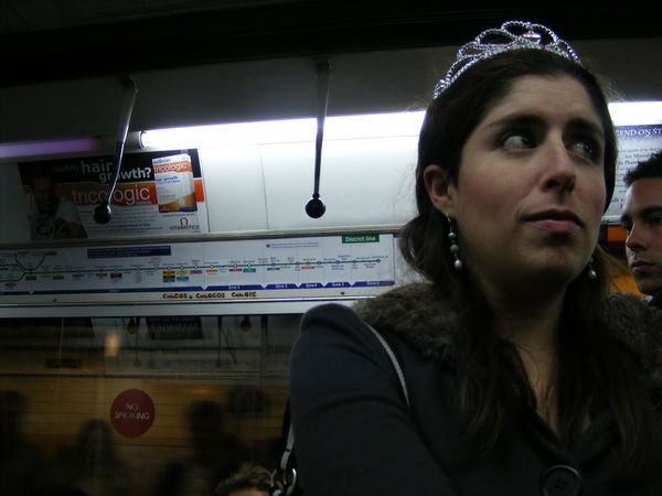 Julia wearing a tiara on the tube