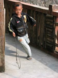 Hani kid playing with hoop