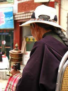 Local woman with prayer wheel