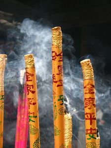 Burning incense at Lingyun Temple in Leshan