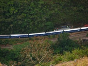 Train in the valley below Machu Picchu