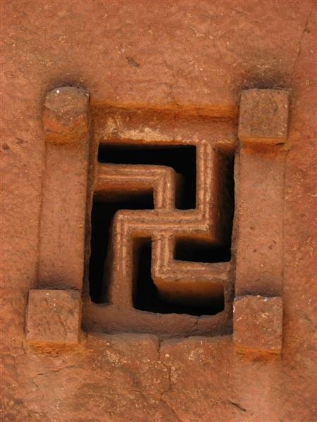 Left-facing swastika window
