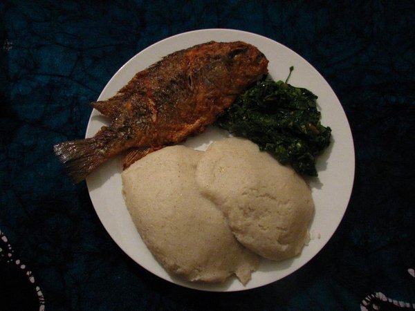 Chambo (bream-like fish), green veg, and nsima (maize stodge)