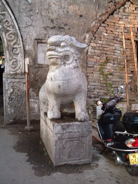 Stone dog guarding the wall's main gate