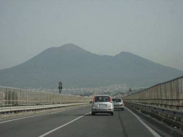 Vesuvio looms over the highway to modern-day Napoli