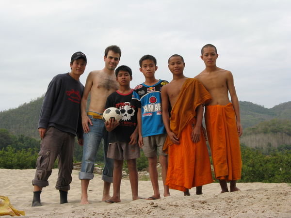 Football with funny lao kids and young monks