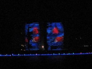 The sides of these huge resort buildings become video screens at night.