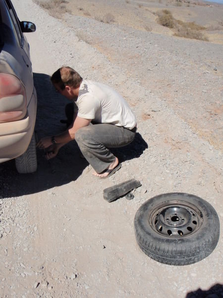 Dain fixing the flat tire