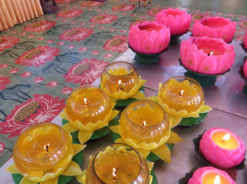 Candles and tiled floor in the Chaiya Magalaram Buddhist Temple