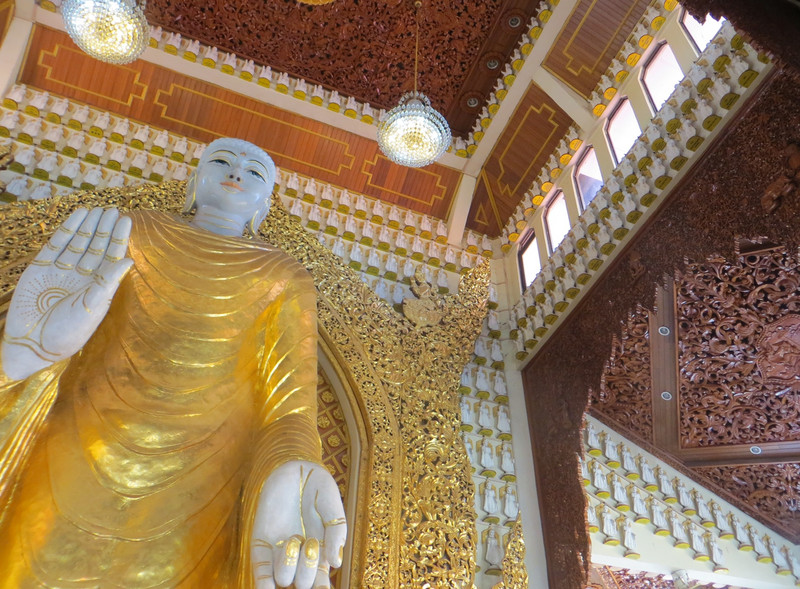 Golden Buddha and carved ceilings at the Burmese Temple