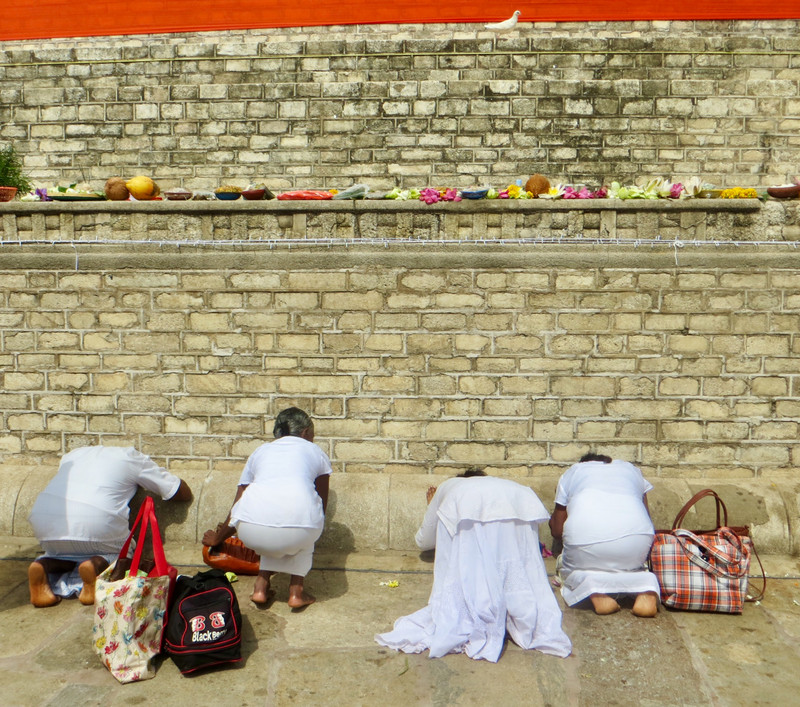 Praying at the base of Ruvanvelisaya Dagoba 
