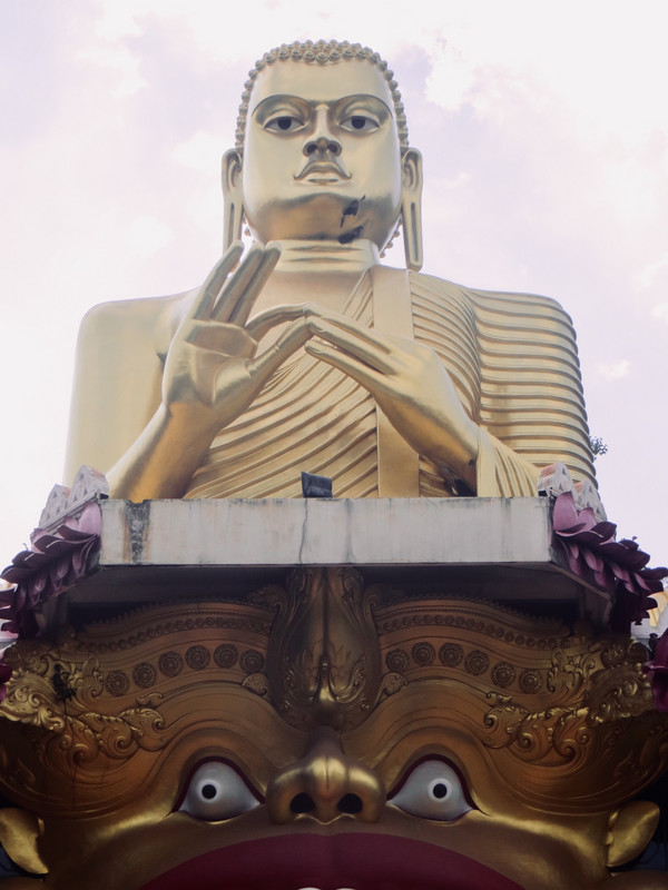 The enormous golden sitting Buddha statue near the Dambulla cave temples