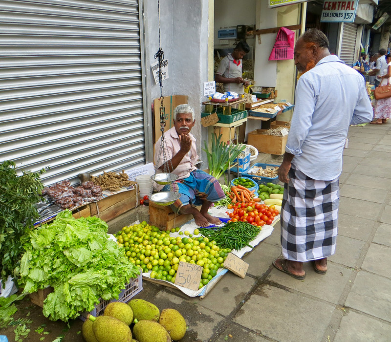 Selling vegetables in the Main Street, Kandy