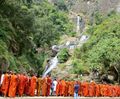 Sightseeing monks at Rawana Ella waterfall