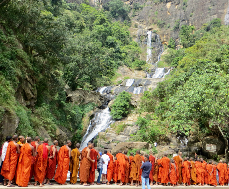 Sightseeing monks at Rawana Ella waterfall.