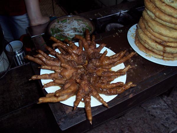 Chinken feet and Naxi bread , which was fried and quite heavy to eat.