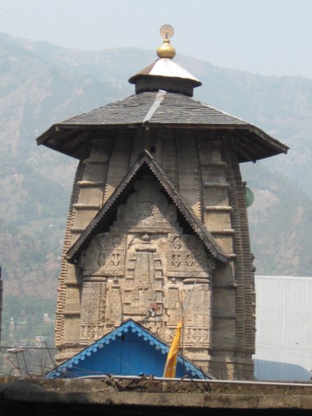 temple top with umbrella slate roof and gold cap