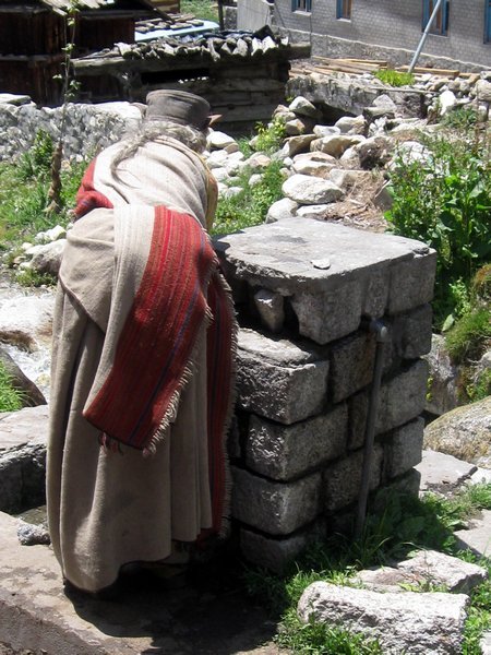 Lady in Chitkul washing