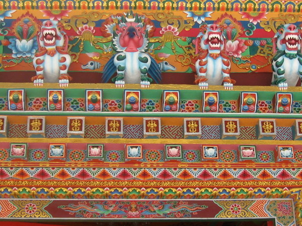Detail of paintings on exterior at Kaza Monastery