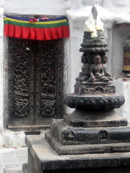 Door and statue at  the Buddhist Stupa 