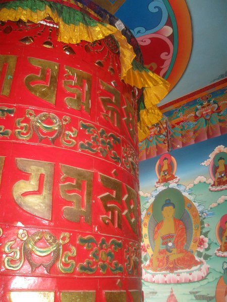 Spinning prayer wheel at the large Buddhist stupa