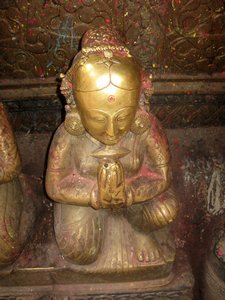 Brass icon covered in wax at the Golden Temple in Patan