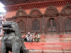 Relaxing on the steps of temple in Durbar Square
