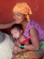 Mother and child grinding corn in Ramkot