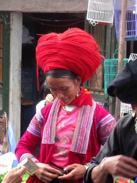 A crown of red wool at Sin Ho - a Red H'Mong lady