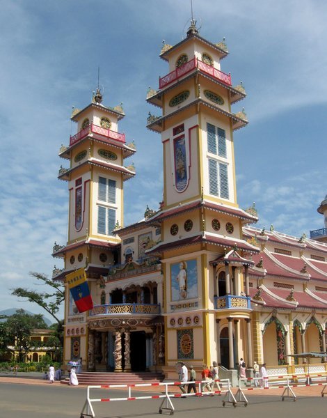 The brightly coloured Cao Dai temple