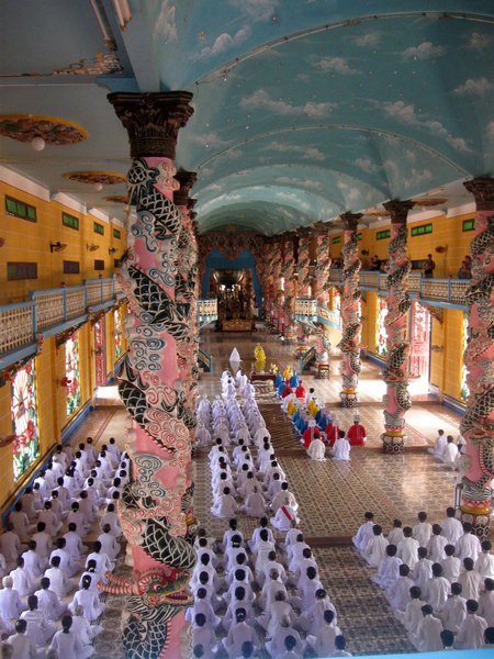The colourful interior of the Cao Dai temple