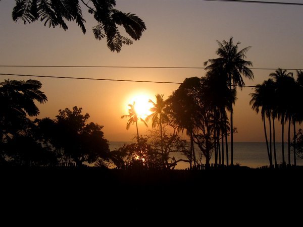 Sunset and palm trees at Kep beach