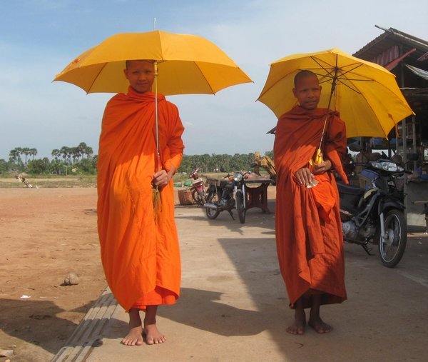 Monks posing at the local market