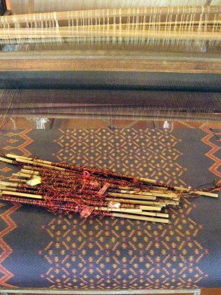 Weaving the traditional pattern from pre dyed threads