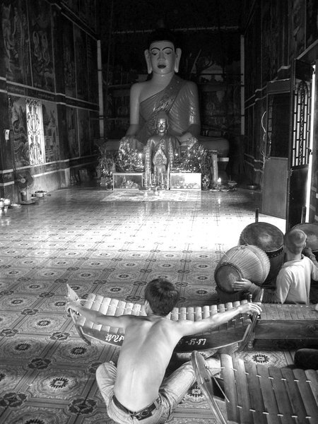 Boys playing music in temple at Stung Treng