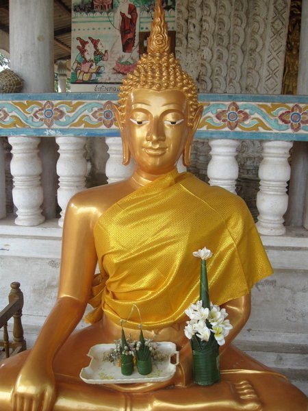 Offerings to a Golden Buddha