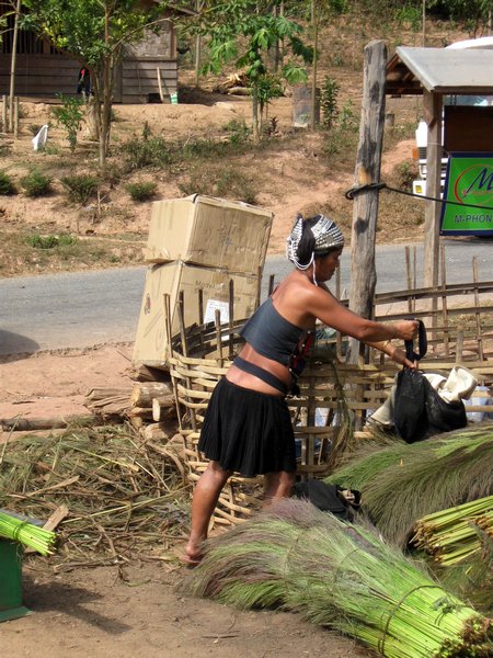 Lady in traditional dress in roadside village