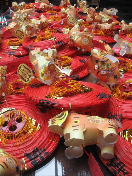 Paper tigers attached to lanterns  to hang for good luck in the temples 
