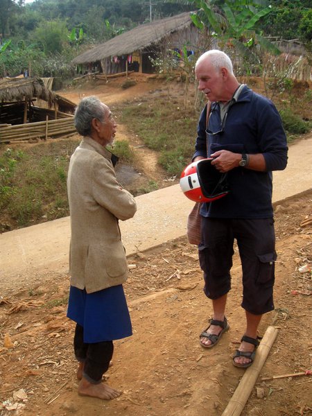 Jerry 'chatting' to an old man in one of the villages