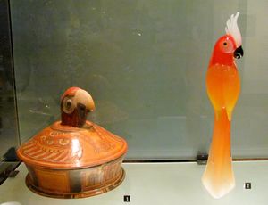Glass and clay bird at museum