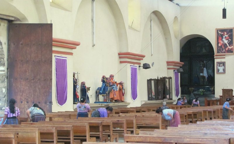 Cleaning the church after Sunday Mass