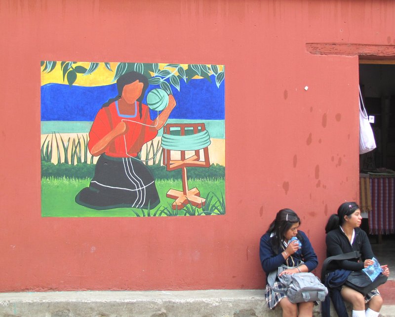 Schoolgirls and unfinished mural in San Juan